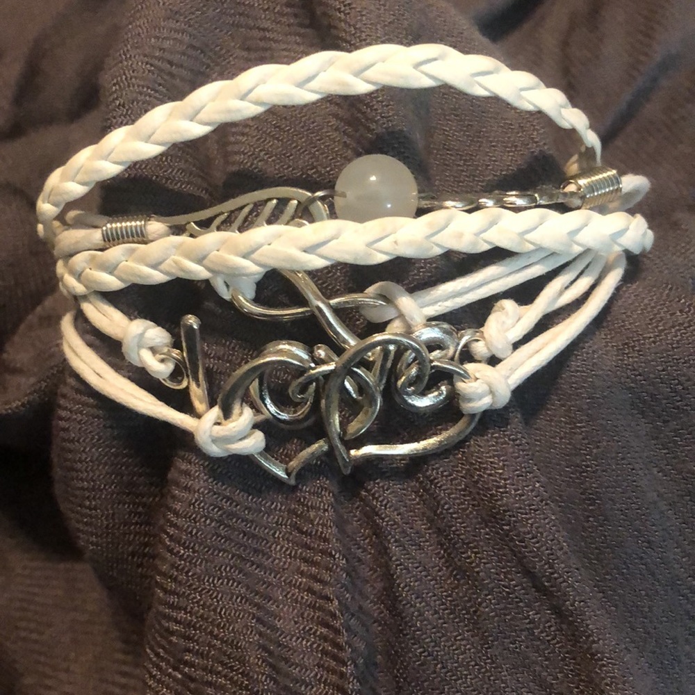 NWT Faux white leather cord & silver “love” bracelet. 7” with 2” extender.